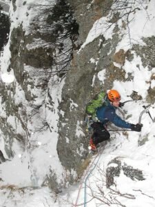 Me climbing through the mixed crux. Photo Robin Beadle